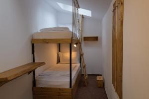 a room with two bunk beds in a room at Vila M 36 in Topliţa