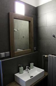 a bathroom with a white sink and a mirror at Hotel Lucia in Veselí nad Lužnicí