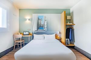 Postel nebo postele na pokoji v ubytování B&B HOTEL Nancy Frouard