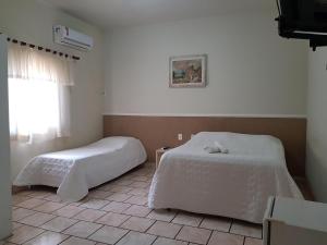 Säng eller sängar i ett rum på Esplanada Hotel