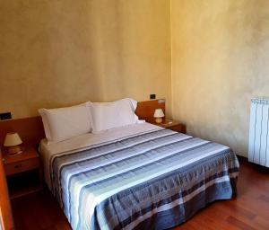 Katil atau katil-katil dalam bilik di Albergo Leon d'Oro