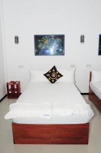Letto o letti in una camera di Sunstar Nilaveli