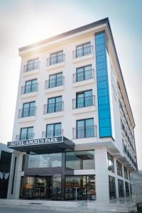 a white building with a sign that reads hotel angels park at ANGEL'S PARK HOTEL in Denizli