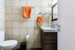 a bathroom with a toilet and a sink at Carlo Vivari House in Vivari