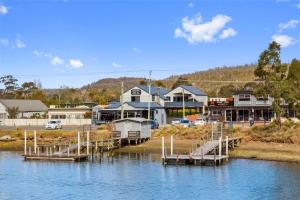 a marina in a town with houses on the water at East Coast Hideaway Beach Retreat in Orford