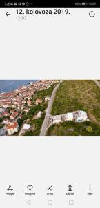 an aerial view of a city with houses and a road at Luxury apartment Prestige Villa Bellevue in Vis