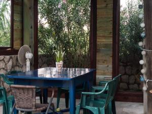 a blue table and chairs on a patio at Apartments Boki in Pag