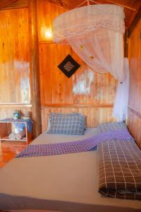 Säng eller sängar i ett rum på Sapa Orange Homestay