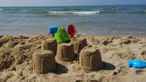 a sand castle on the beach near the ocean at CASA CARGIA' HOLIDAYS in San Terenzo