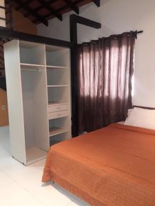 Giường trong phòng chung tại Hotel Casa Jardin