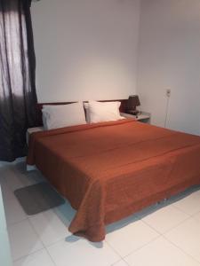 Giường trong phòng chung tại Hotel Casa Jardin
