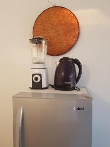a blender sitting on top of a refrigerator at Nakupenda Malaika Flat in Pwani Mchangani