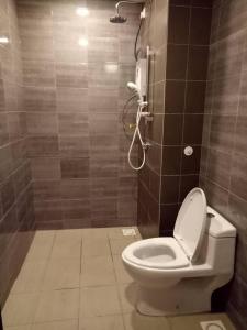 a bathroom with a toilet and a shower at Simfoni Balakong Internet & Netflix Designer Studio in Kampong Baharu Balakong
