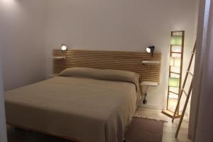 A bed or beds in a room at Lanterna sul mare