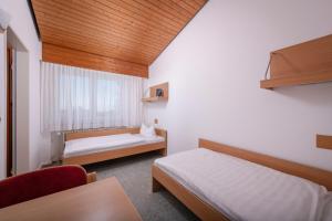 Postel nebo postele na pokoji v ubytování Ferienclub Maierhöfen + 37 fotografií