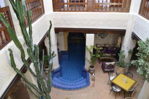 an overhead view of a house with a blue tile floor at Riad Bayti in Marrakesh