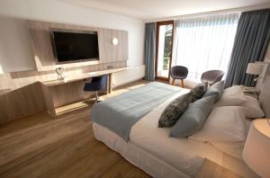 Ένα ή περισσότερα κρεβάτια σε δωμάτιο στο Yachting Hotel Quintero