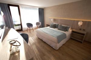 Yachting Hotel Quintero客房内的一张或多张床位