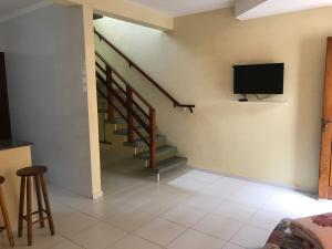 TV in/ali zabaviščno središče v nastanitvi Mar e Lua Flats - Maresias