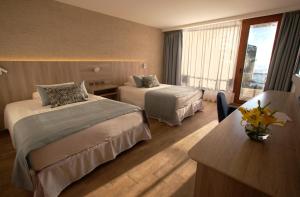 Yachting Hotel Quintero客房内的一张或多张床位