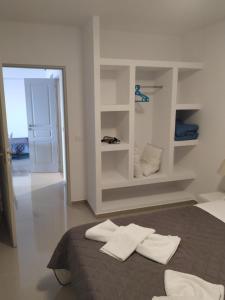 Postel nebo postele na pokoji v ubytování Villa Ioanna Tinos + 37 fotografií
