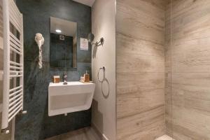 a bathroom with a sink and a shower at Ares ApartHotel in Cluj-Napoca +112 photos