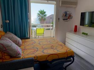 Llit o llits en una habitació de Domaine de La Coudouliere, Vue Mer, Plage, Piscine et Parc