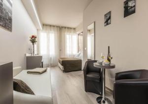 A seating area at Astoria Deluxe rooms