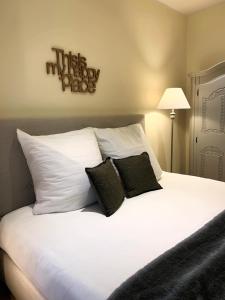 a large white bed with two pillows on it at glorious cloud apartment in Berlin