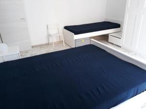 Tempat tidur dalam kamar di ROCCALUMERA ZONA TAORMINA 50M DAL MARE