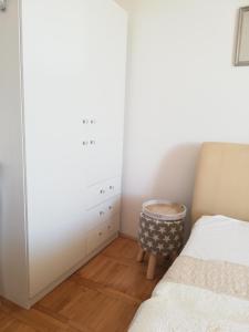 Postel nebo postele na pokoji v ubytování Apartmani Paula