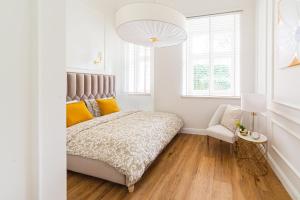 Łóżko lub łóżka w pokoju w obiekcie Apartament Golden Place