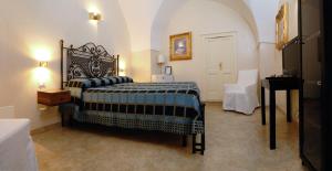 Postel nebo postele na pokoji v ubytování Dimora Storica ''Casa Sicuro''