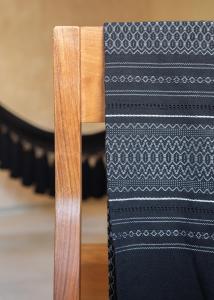 a close up of the back of a wooden chair at Hotel Ma'xanab Tulum in Tulum