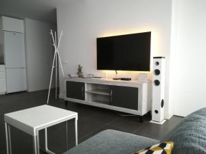 A television and/or entertainment centre at Marta & Lorenzo Apartment. Fuerteventura