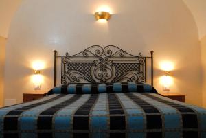 Postel nebo postele na pokoji v ubytování Dimora Storica ''Casa Sicuro''