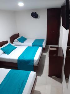 Postel nebo postele na pokoji v ubytování Hotel Center
