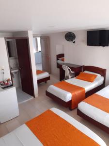 Postel nebo postele na pokoji v ubytování Hotel Center