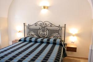 Postel nebo postele na pokoji v ubytování Dimora Storica ''Casa Sicuro''