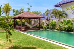 a backyard with a gazebo and a swimming pool at Villa Nonnavana - 12-minute walk to Batu Bolong Beach in Canggu