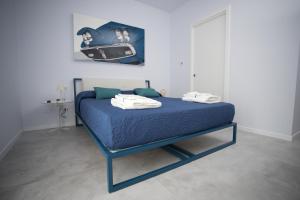 A bed or beds in a room at Casa Elisa Dimora Urbana