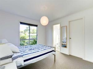 Do Drop Inn - Port Willunga - C21 SouthCoast Holidays客房内的一张或多张床位