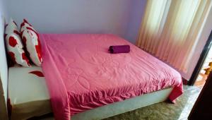 Perwita Homestay客房内的一张或多张床位