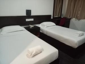 Postel nebo postele na pokoji v ubytování Hotel Sunjoy9 OKR