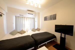 A bed or beds in a room at Allstay GOYA