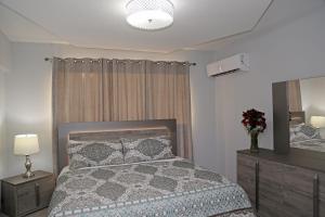 Itza-Bella Suites 객실 침대