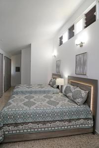 Itza-Bella Suites 객실 침대