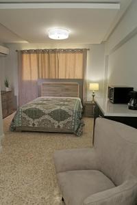 Itza-Bella Suites 객실 침대