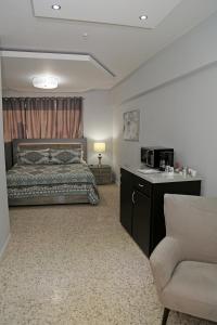 Itza-Bella Suites 객실 침대