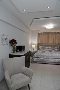 Itza-Bella Suites 객실 침대